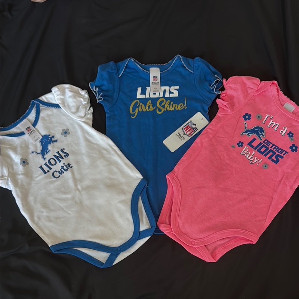 NFL Detroit Lions Baby Onesies in Blue, White, and Pink